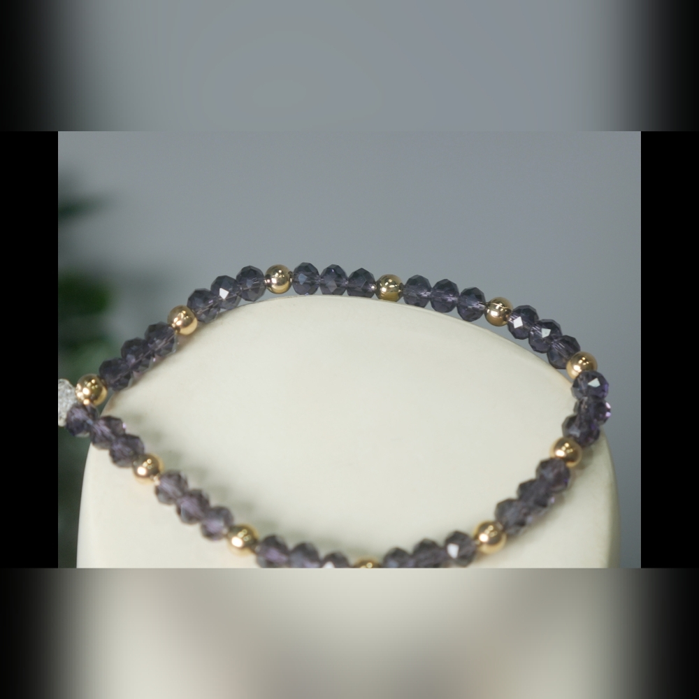 Golden bead and purple bracelet